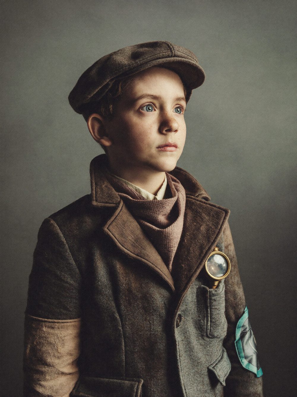 Character card: the Boy, ten to twelve, patched wool coat and flat cap.
