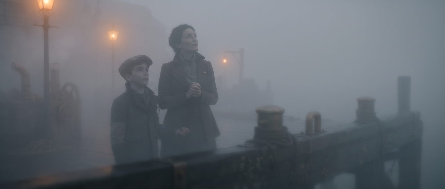 The same frame swallowed by fog, ghost silhouettes only.